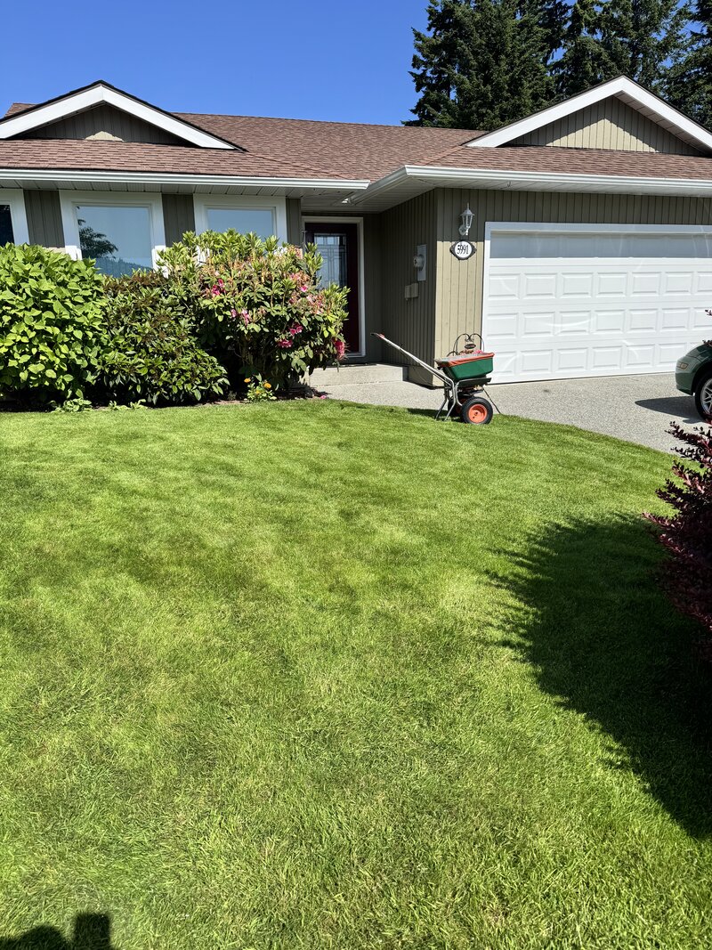 Beautiful residential home with lush green lawn maintained by Elite